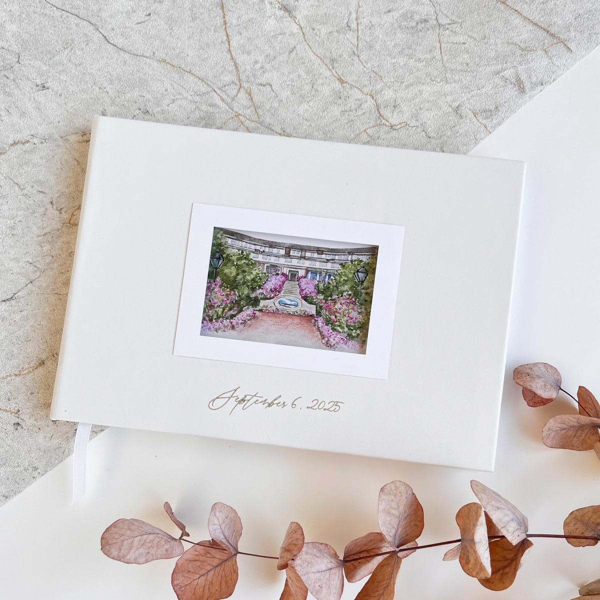 Personalized navy blue wedding guestbook with custom venue watercolor illustration, luxury vegan leather, perfect for weddings, anniversaries, and special events.
