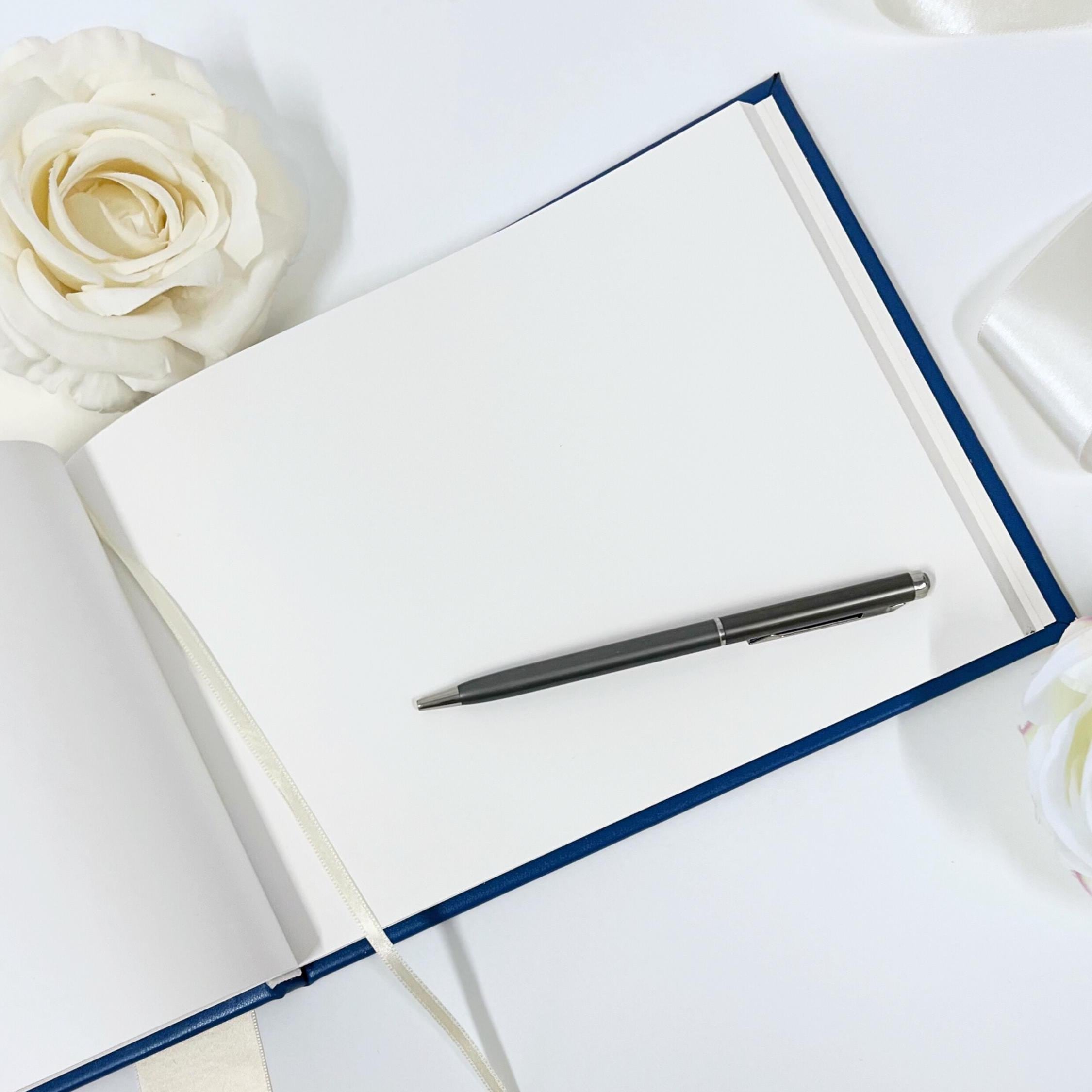 Custom-made blue leather wedding guest book with watercolor illustration of the venue, a personalized gift for weddings, anniversaries, and celebrations of important events.