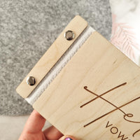Side view of the Her Vows wedding vow book.
