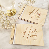 Set of two personalized wooden vow books engraved with His Vows and Her Vows, along with the wedding date, on natural wood covers.