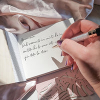 Open view of the Her Vows wooden vow book, showing cream-colored pages with handwritten vows - great for weddings or vow renewals.