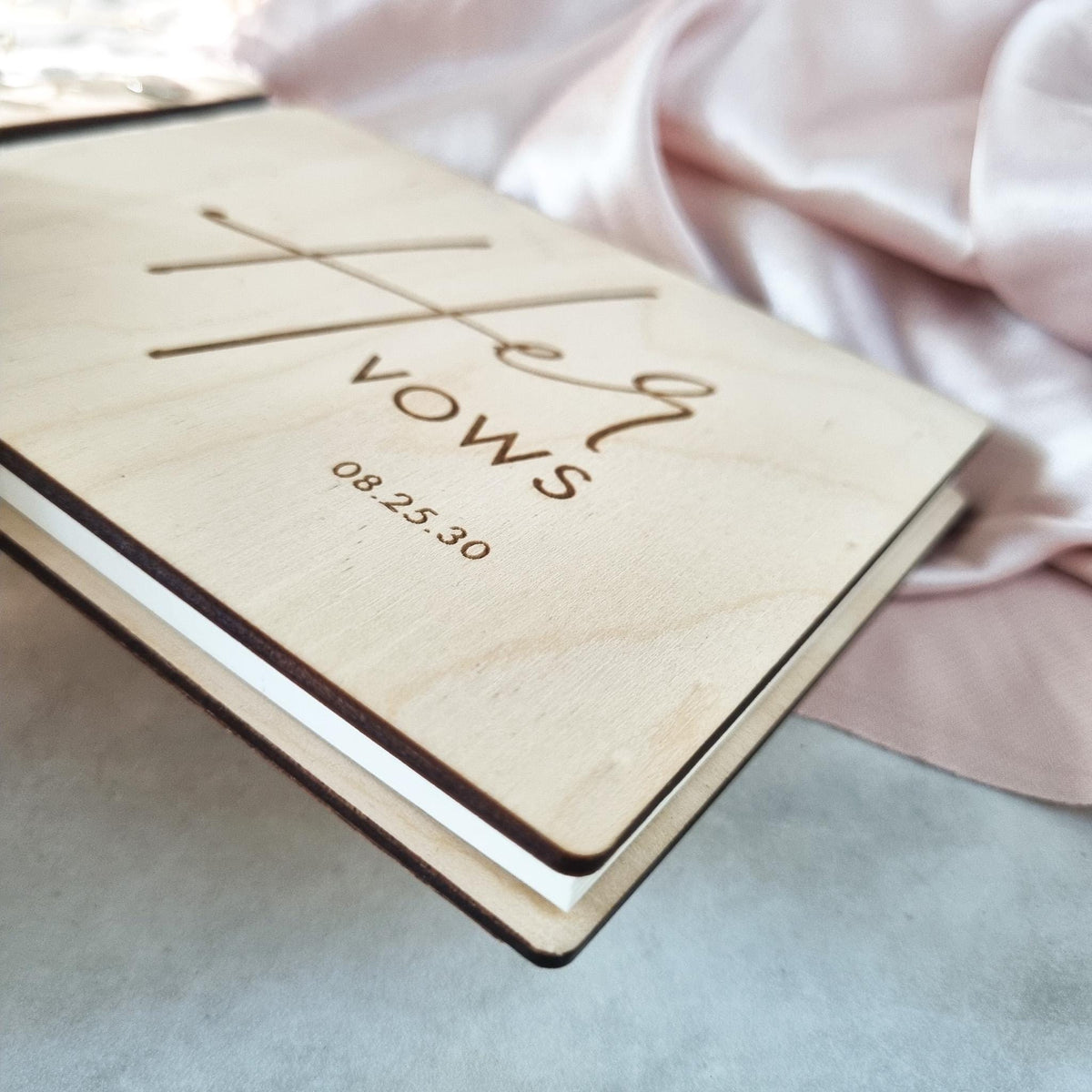 Side view of the Her Vows wedding vow book.
