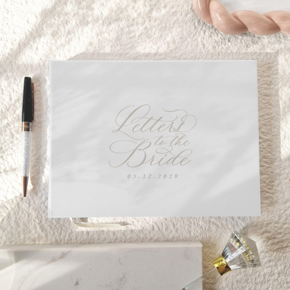 Elegant “Letters to the Bride” book with white vegan leather cover and engraved date. Perfect for bridal showers or weddings, where guests can share advice, letters, and heartfelt wishes. A timeless keepsake for the bride to treasure forever.