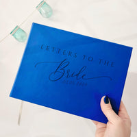 “Letters to the Bride” book with royal blue vegan leather cover and custom engraving. Perfect for bridal showers or weddings, where friends and family can share heartfelt letters, advice, and wishes – a treasured keepsake for the bride.