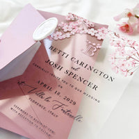 Acrylic wedding card with Japanese cherry blossom design, blush envelope liner, and decorative wax seal.