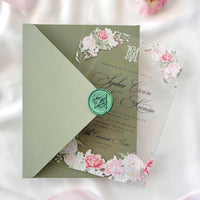 Clear plexiglass floral wedding invite featuring roses, sage envelope with printed liner, sealed with custom monogram wax.