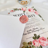 Modern plexiglass wedding invitation with rose design, crisp white envelope, and rose-printed liner for a romantic look.