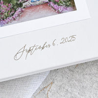 Elegant custom wedding guest book in white vegan leather, featuring laser-engraved dates, ideal as a wedding gift or keepsake.