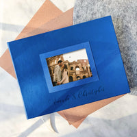 A custom-made leather wedding guest book with a photo of the couple is a personalized gift for weddings, anniversaries, and celebrations of important events.