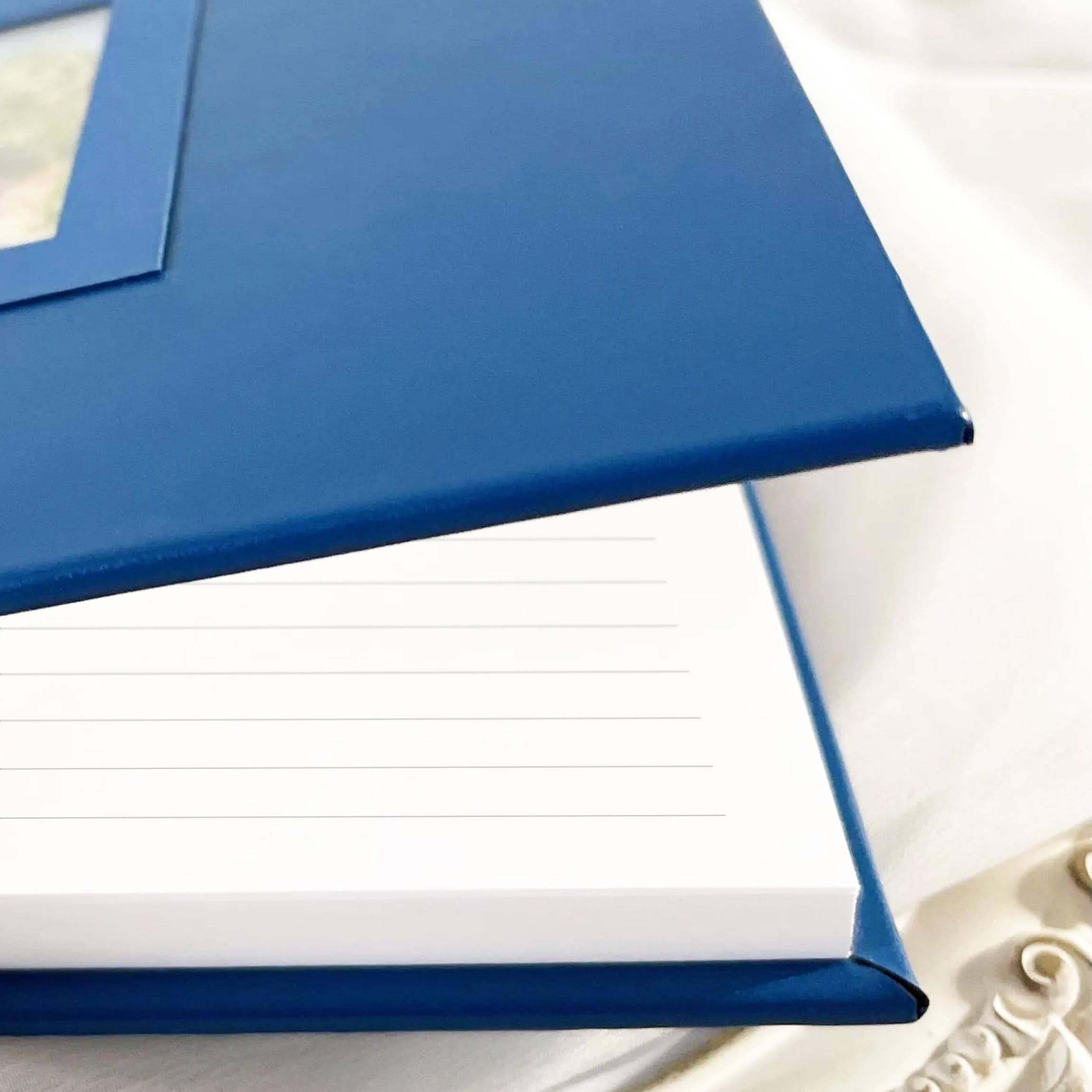Custom-made leather wedding guest book with watercolor illustration of the venue and lined pages