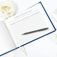 Custom-made leather wedding guest book with watercolor illustration of the venue and lined pages