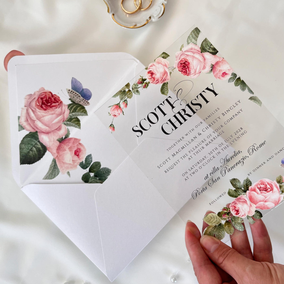 Rose acrylic wedding invitation set with white envelope, printed rose liner, and decorative wax seal.